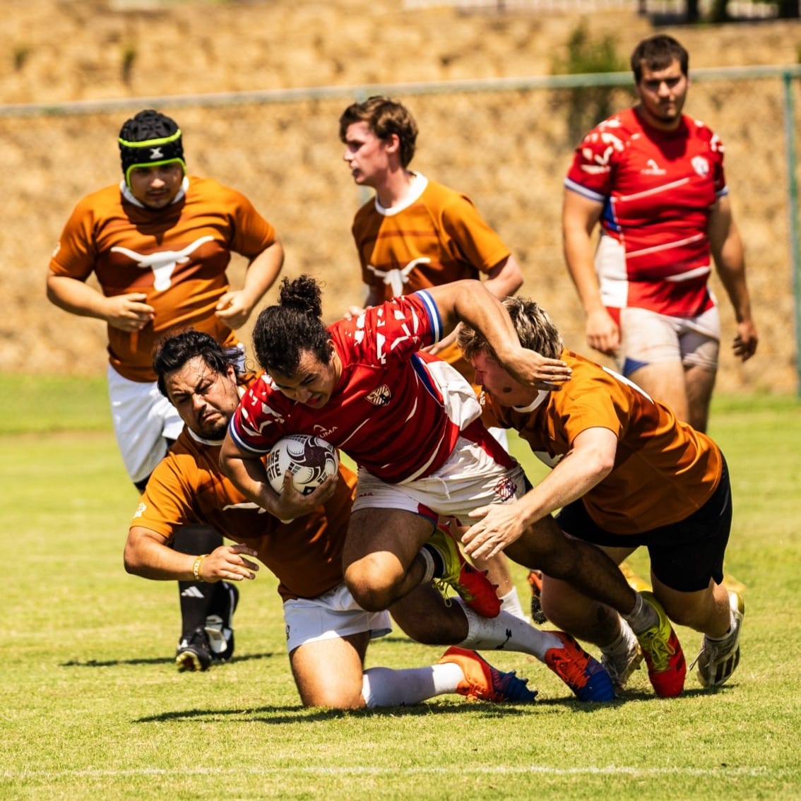 UT PGE PhD student Julio Villarroel plays defense for the UT rugby team.