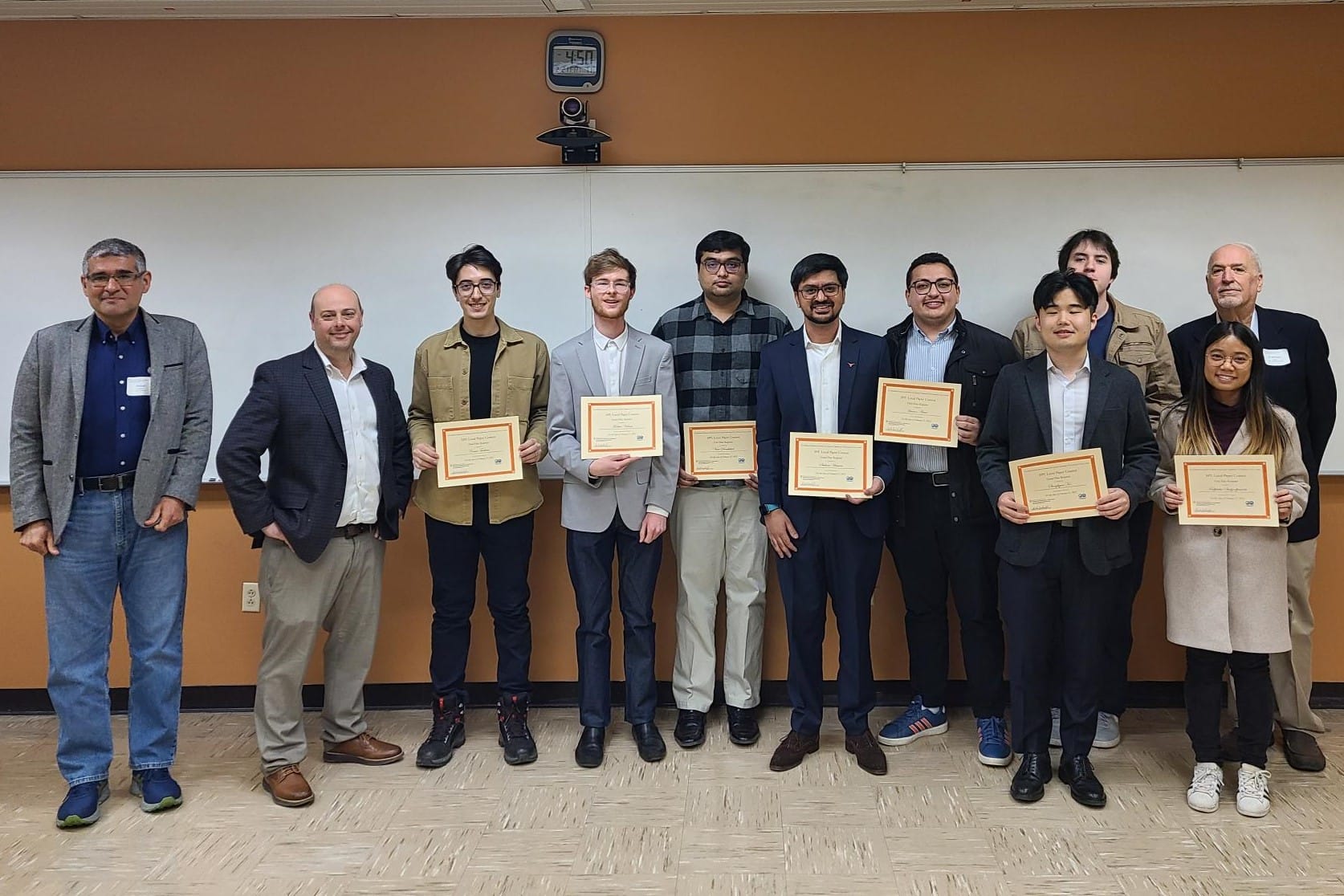 SPE Paper Contest winners with judges and UT PGE department chair