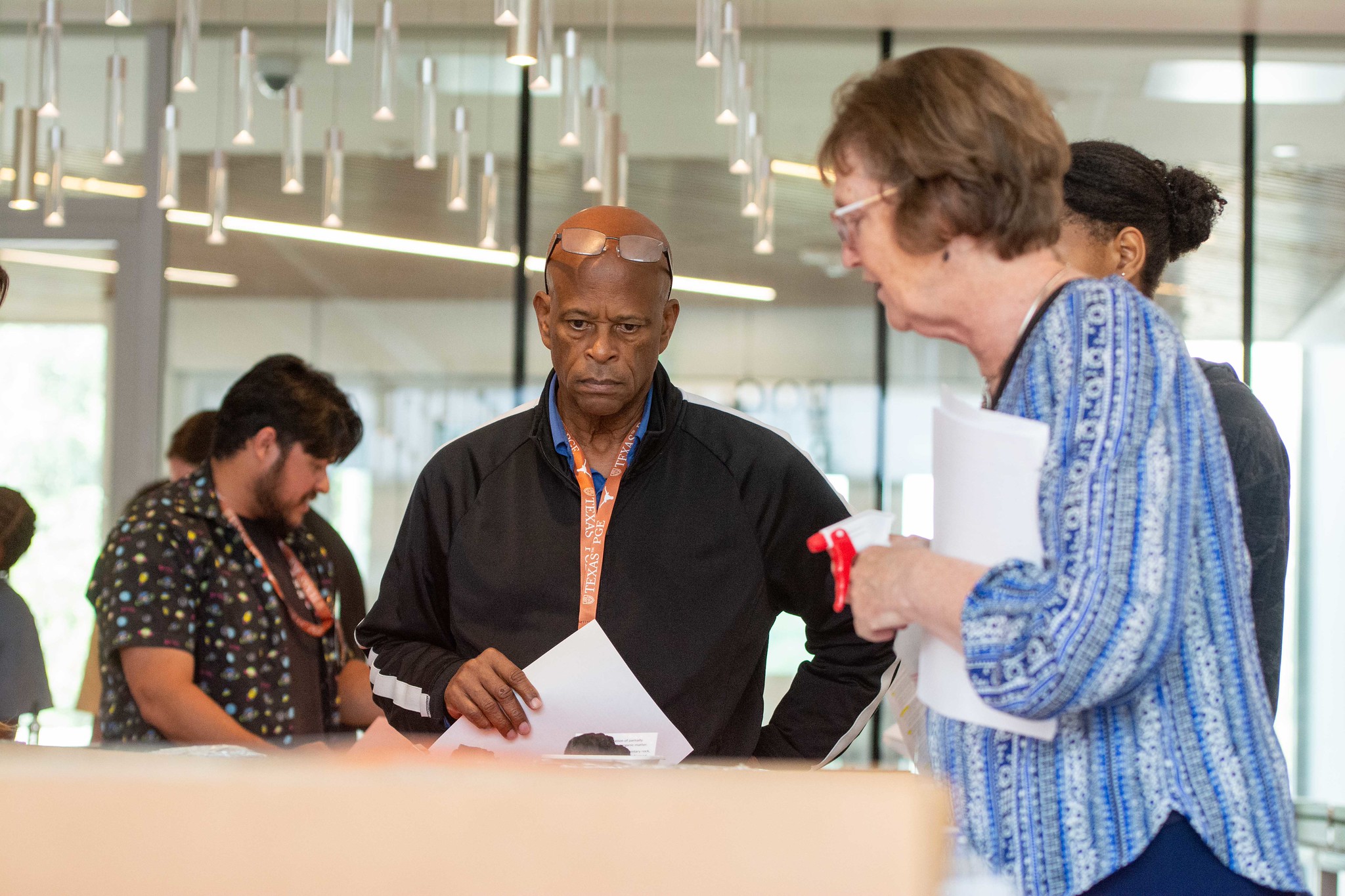 Educators gathered around demo tables during Energy Science and Technology Institute workshop.